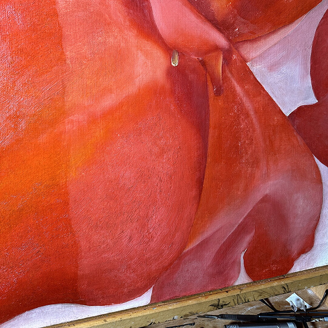 A close-up of an oil painting showing partially cleaned sections, including an pink petal toward the bottom.