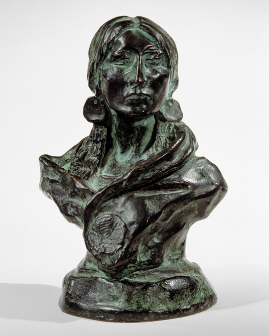 A bronze sculpture with a slight green patina of the bust of an American Indian woman.