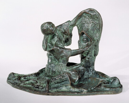 A bronze sculpture of a Native American woman looking at a child propped upright in a cradleboard.