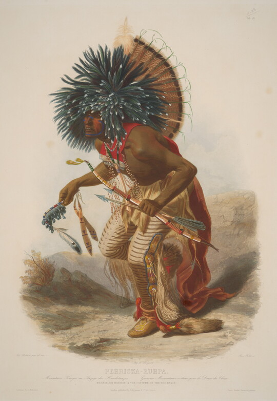 A color print of an Indigenous man wearing a heavily feathered headdress that falls over his painted face, a cape and beaded leggings; he is crouched as if dancing and holds a bow and arrow in one hand.