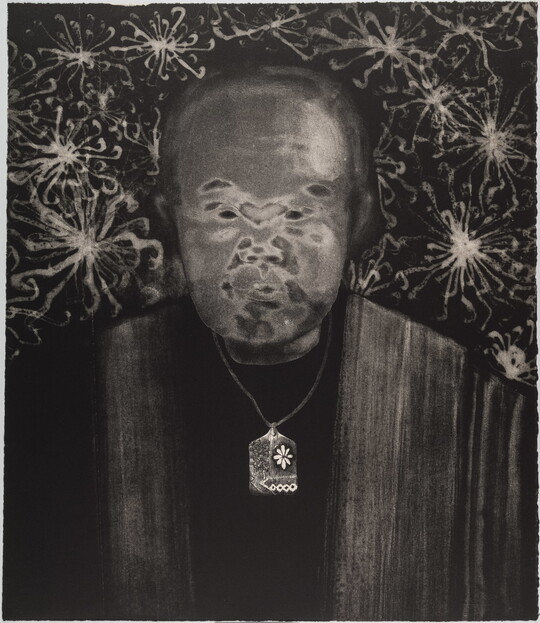 A black-and-white print of an abstracted man with Asian features, a gray face, and wearing a delicate patterned necklace all on a dark background filled with flower-like designs.