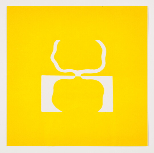 A color print of abstract, tree-like shapes: on the top, a white outline on yellow, and reflected on the bottom, a yellow shape on white.