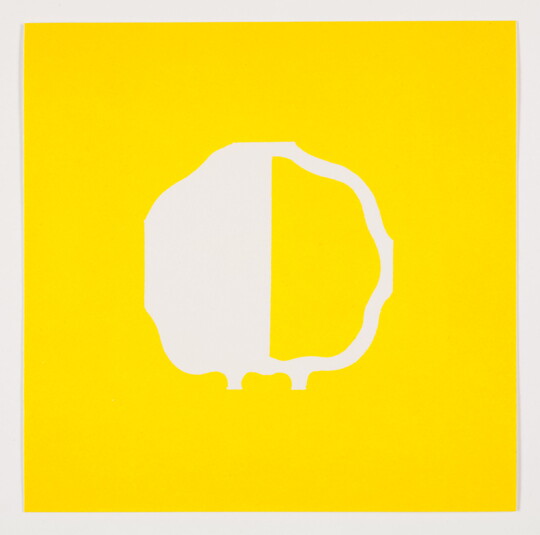 A color print of an abstract, almost round shape outlined in white, the left half white and the right half yellow, all on a yellow background.