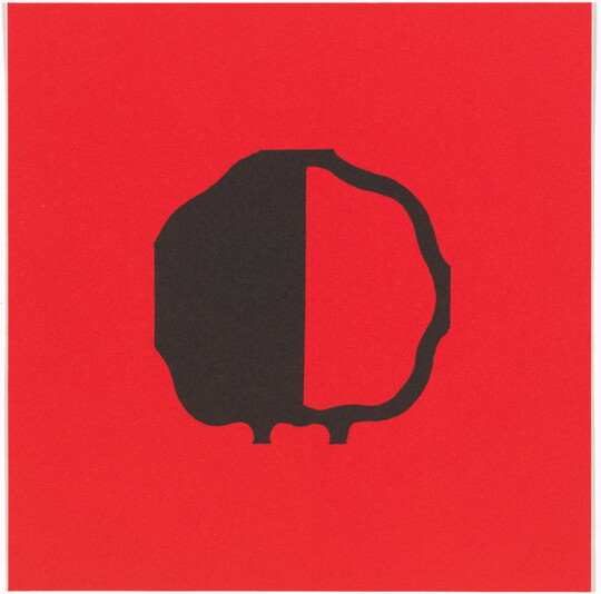 A color print of an abstract, almost round shape outlined in black, the left half black and the right half red, all on a red background.