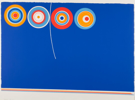 An abstract color print of four multicolored circles with rings of yellow, white, and orange on a blue background.