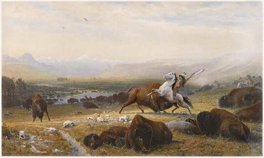 A painting of a Native American on horseback spearing a bison in a field full of bison, some dead or injured.