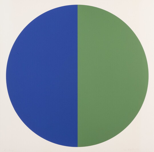 A color print of a circle, right half blue and the left half green, that fills the background.