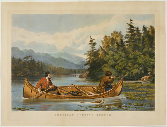 A color print of two White men in a canoe on a lake; the man at the back paddles as the other aims his rifle at a stag on shore.