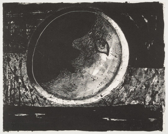 A black-and-white print of a crescent moon with an eye, nose, and mouth on a black and gray background.