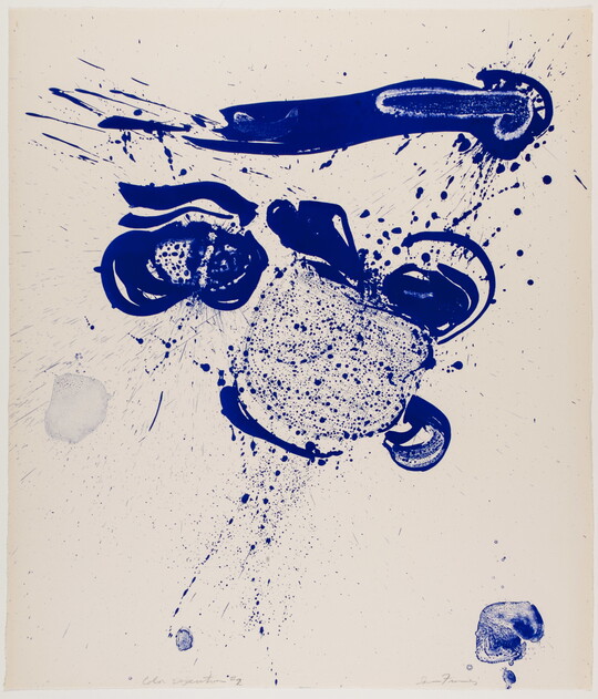 An abstract color print of blue ink blots, streaks, and splatters primarily in the top half of the sheet.