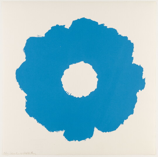 An abstract color print of a blue, flower-like shape with a white circle in the middle.