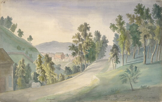 A watercolor of a dirt road surrounded by hills and trees and a city nestled between hills in the distance.