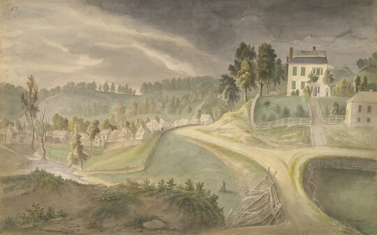 A watercolor of a large house and green yard surrounded by a white fence overlooking a town nestled in the hills.