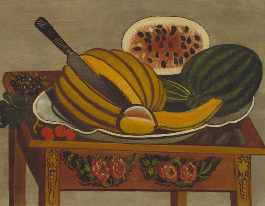 An oil painting of a plate of watermelon, cucumber, and a cut cantaloupe on a wood table painted with floral motifs.