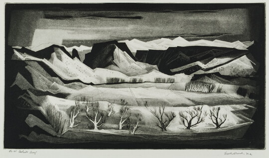 A black-and-white abstract print of a mountain valley and leafless trees in the foreground.