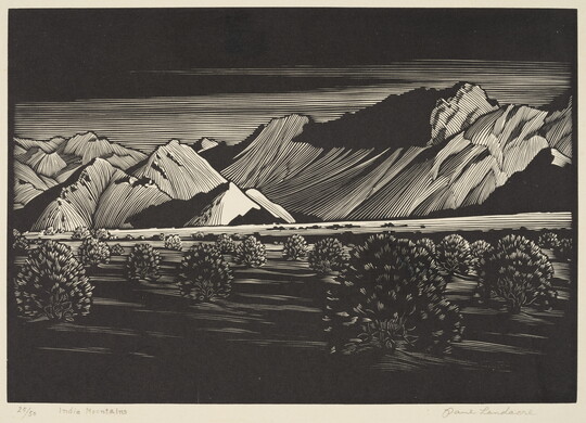 A black-and-white print of tall mountains beyond a desert landscape filled with low vegetation.