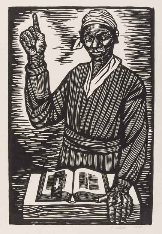 A black-and-white print of a Black woman standing in front of an open Bible, pointing her hand at the sky.