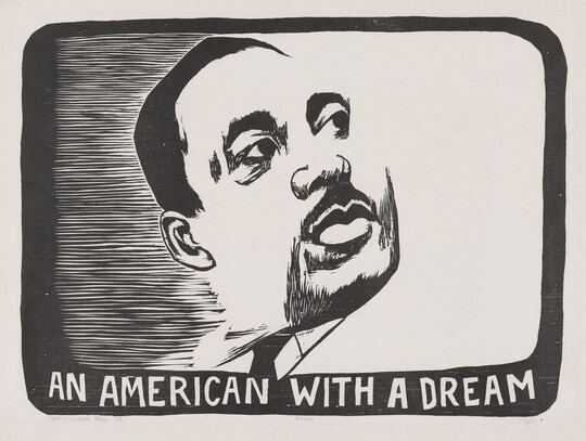 A black-and-white portrait print of the face of a Black man with a mustache above the words "An American with a Dream."