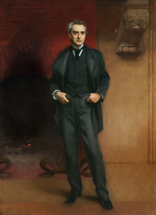 A life-size oil painting of an middle-aged White man in a dark, three-piece suit and tie, thumbs hooked into his front pockets, standing in front of a large fireplace.