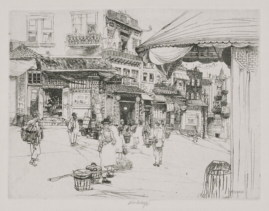 A black-and-white print of a busy street corner with people, some carrying baskets, walking in front of buildings with Asian architectural details.