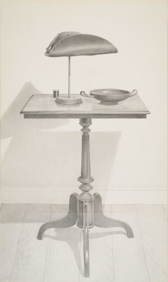 A vertical black-and-white drawing of a table with a tricorn hat on a display pedestal and ancient Greek drinking cup.