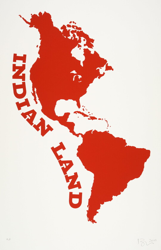 A color print of the silhouettes of North and South America in red with the words "Indian Land" running along the left side.