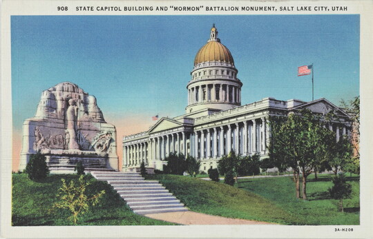 A color postcard of a stone monument and a gold domed government building.