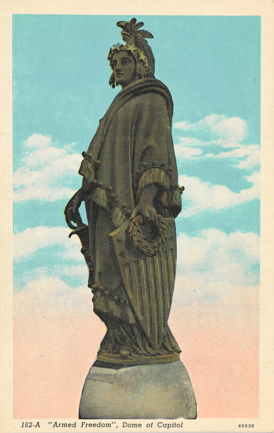 A color postcard of a sculpted figure holding a sword and shield.