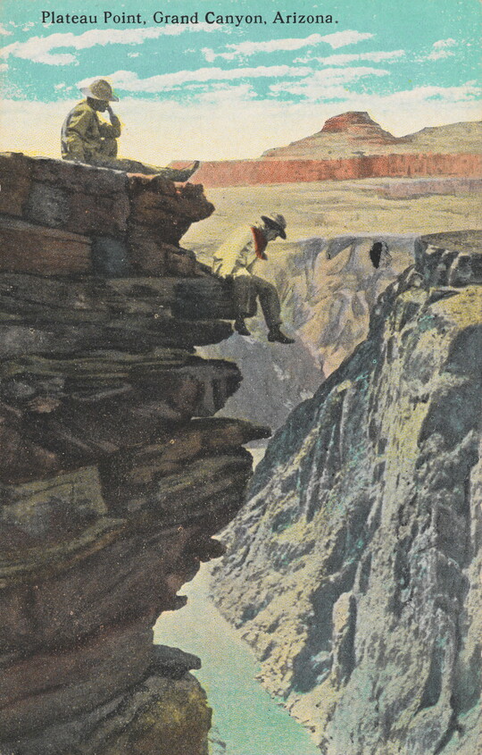 A color photograph postcard of two people, one sitting at the top edge of a cliff and the other on an outcrop of rocks that overlooks a deep canyon with a river at the bottom.