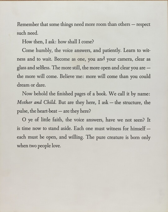 A black-and-white photograph of a white page with four paragraphs of black text.