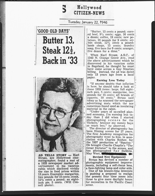 A black-and-white photograph of a newspaper clipping with a headshot of a White man wearing glasses.