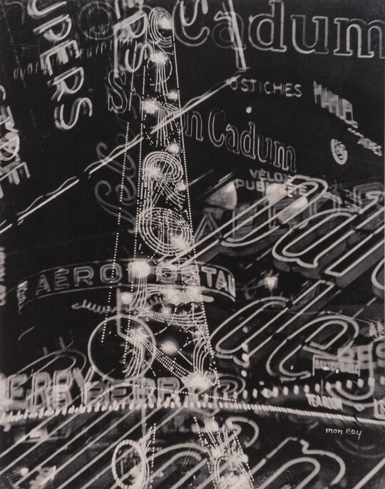 A black-and-white photograph of overlapping commercial neon signs.