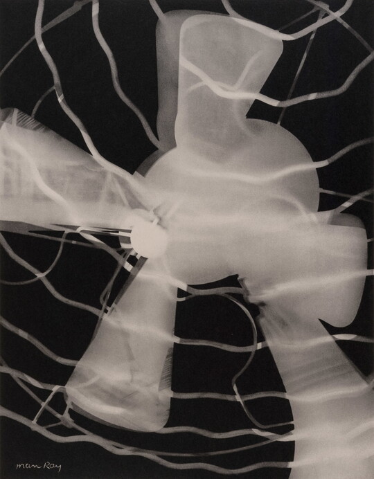 An abstract black-and-white photograph of a white and gray silhouette of an electric fan.