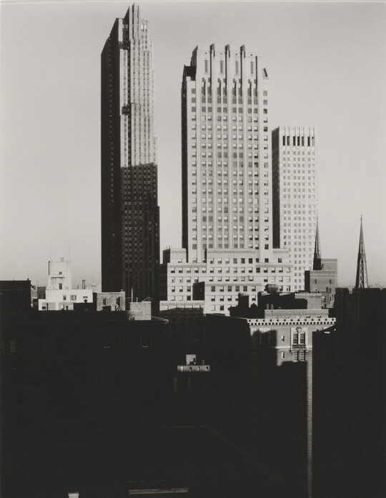 A black-and-white photograph of skyscrapers in New York City. 