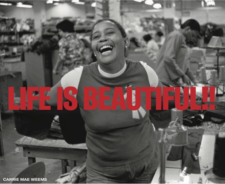 Black and white image of a smiling woman with text overlaid in red that reads: &quot;Life is beautiful!!&quot;