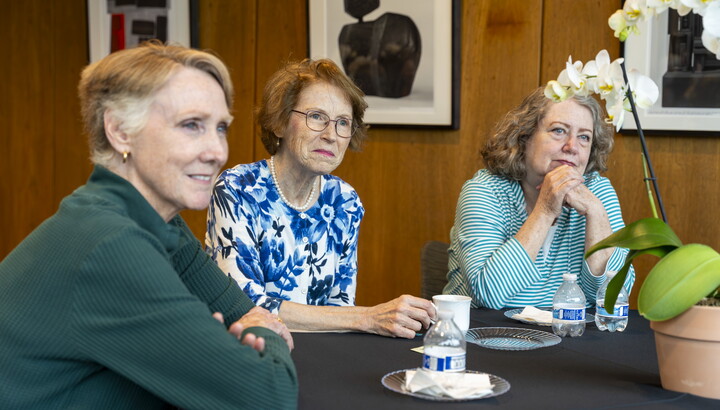 Three older White women sit at a table in the Carter's Lounge enjoying tea and each other's company.