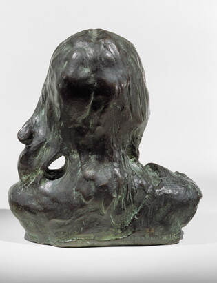 A bronze bust of an Indigenous person.