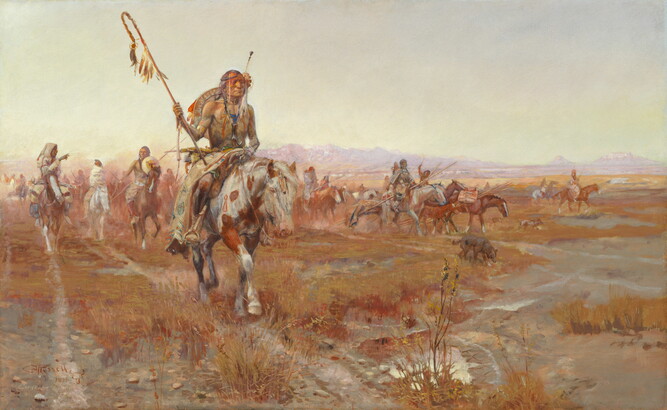 A Native American man wearing elaborate clothing leads a group on horseback through the plains.