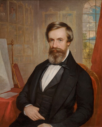 An oil painting of a White man with brown hair and beard wearing bow tie and jacket; artwork hangs salon-style on the walls behind him.