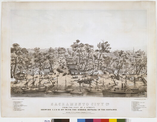 A sepia-toned print of the riverfront of a bustling town with rows of buildings and horse-and-wagon traffic.