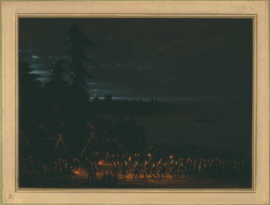 A night scene of Indigenous people gathered together for a torch-lit ceremony.