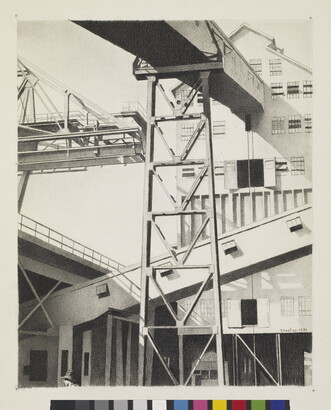 A black-and-white drawing of a multi-story, industrial building with chutes and ramps.