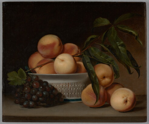 A still life oil painting of a cluster of purple grapes and several peaches next to a white, porcelain basket holding more peaches.