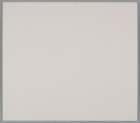 A black-and-white photograph of many-armed cacti growing on sandy soil.