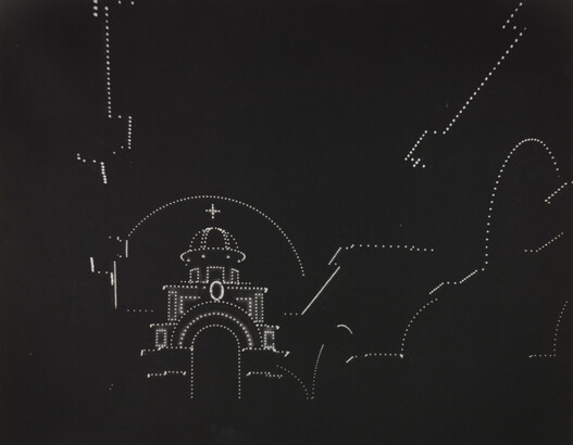 A black-and-white photograph with a pure black background and dotted white lights outlining the shape of a domed cathedral.