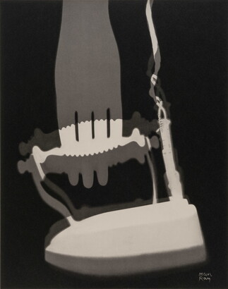 An abstract black-and-white photograph of white and gray silhouettes of what looks like an iron and a fork.