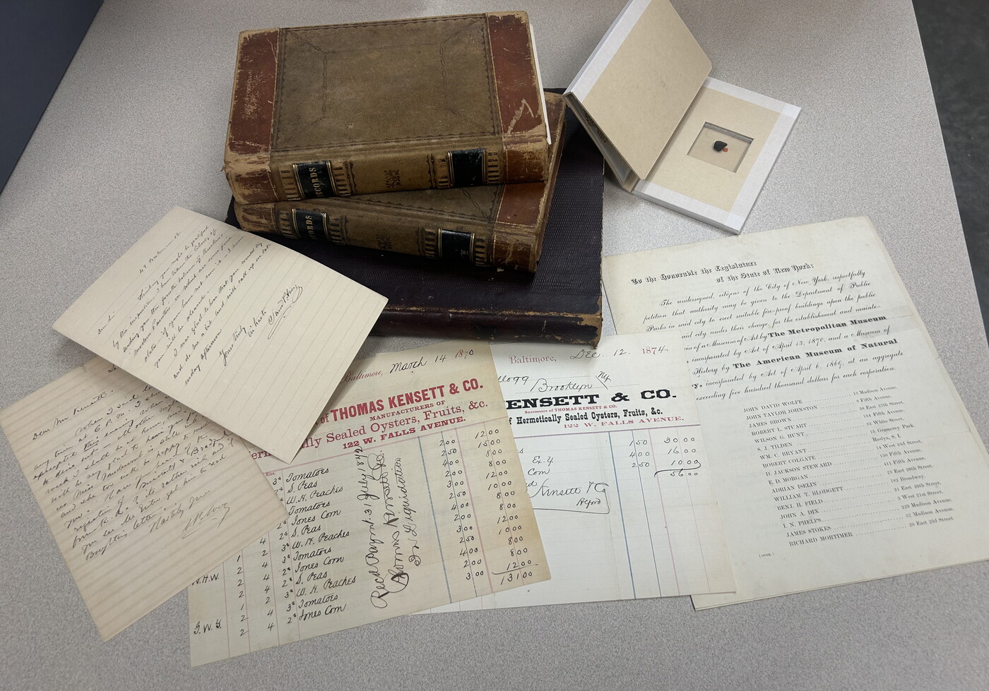 Books and papers arranged on a table.