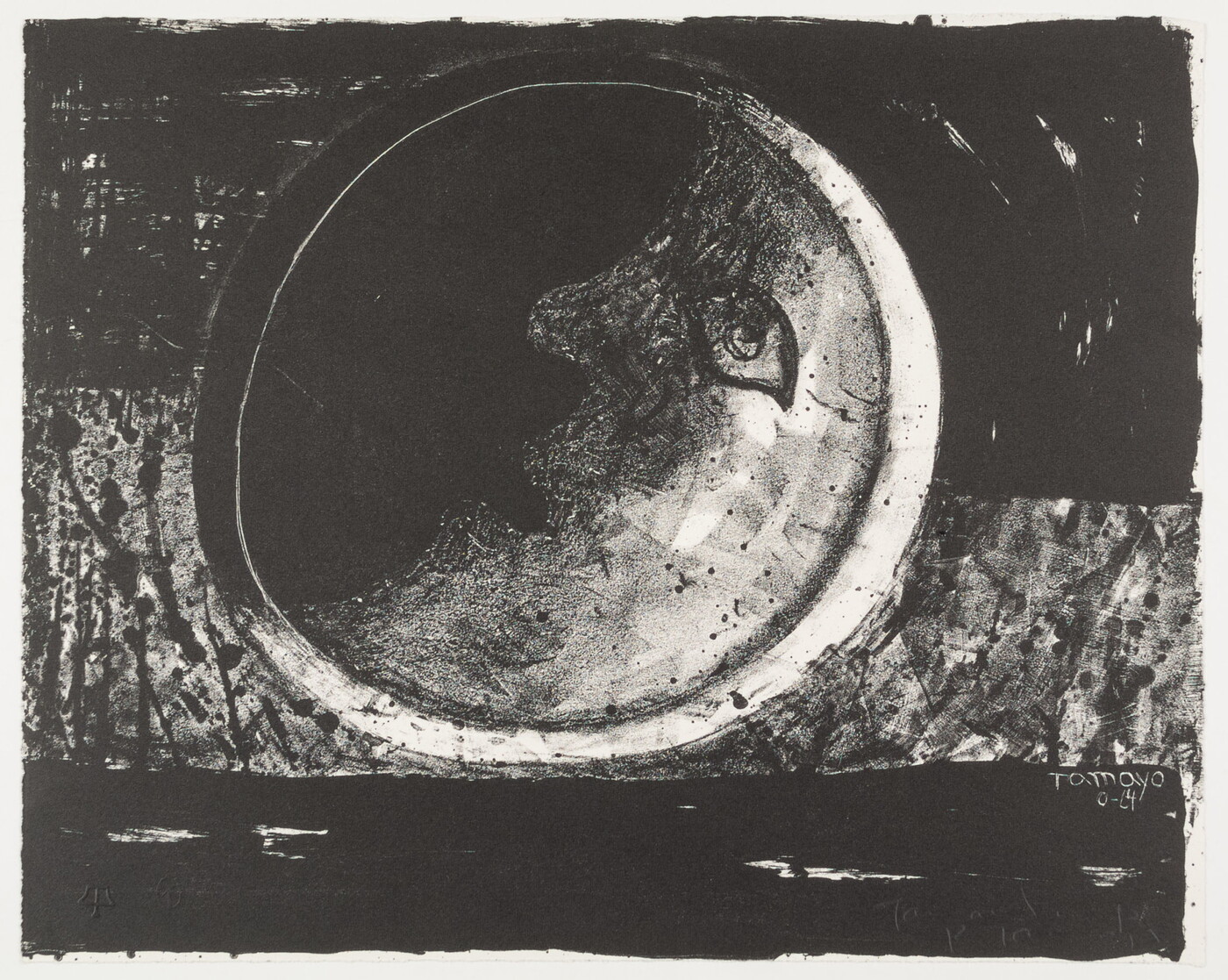 A black-and-white print of a crescent moon with an eye, nose, and mouth on a black and gray background.