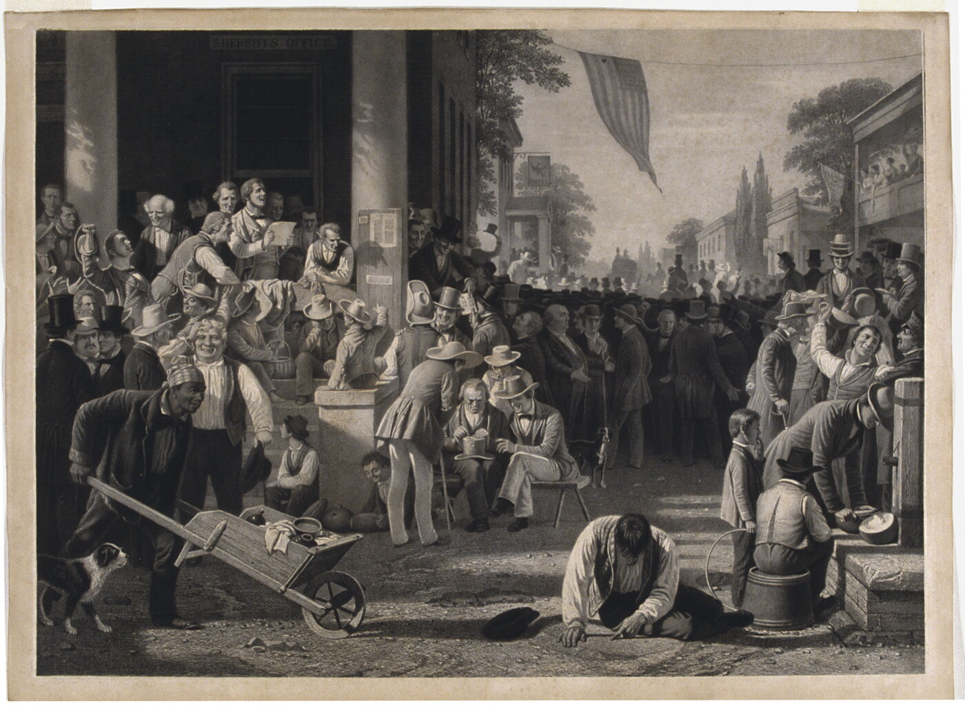 A black-and-white print of a large gathering of mostly White men crowding the street and front steps of the sheriff&#039;s office.