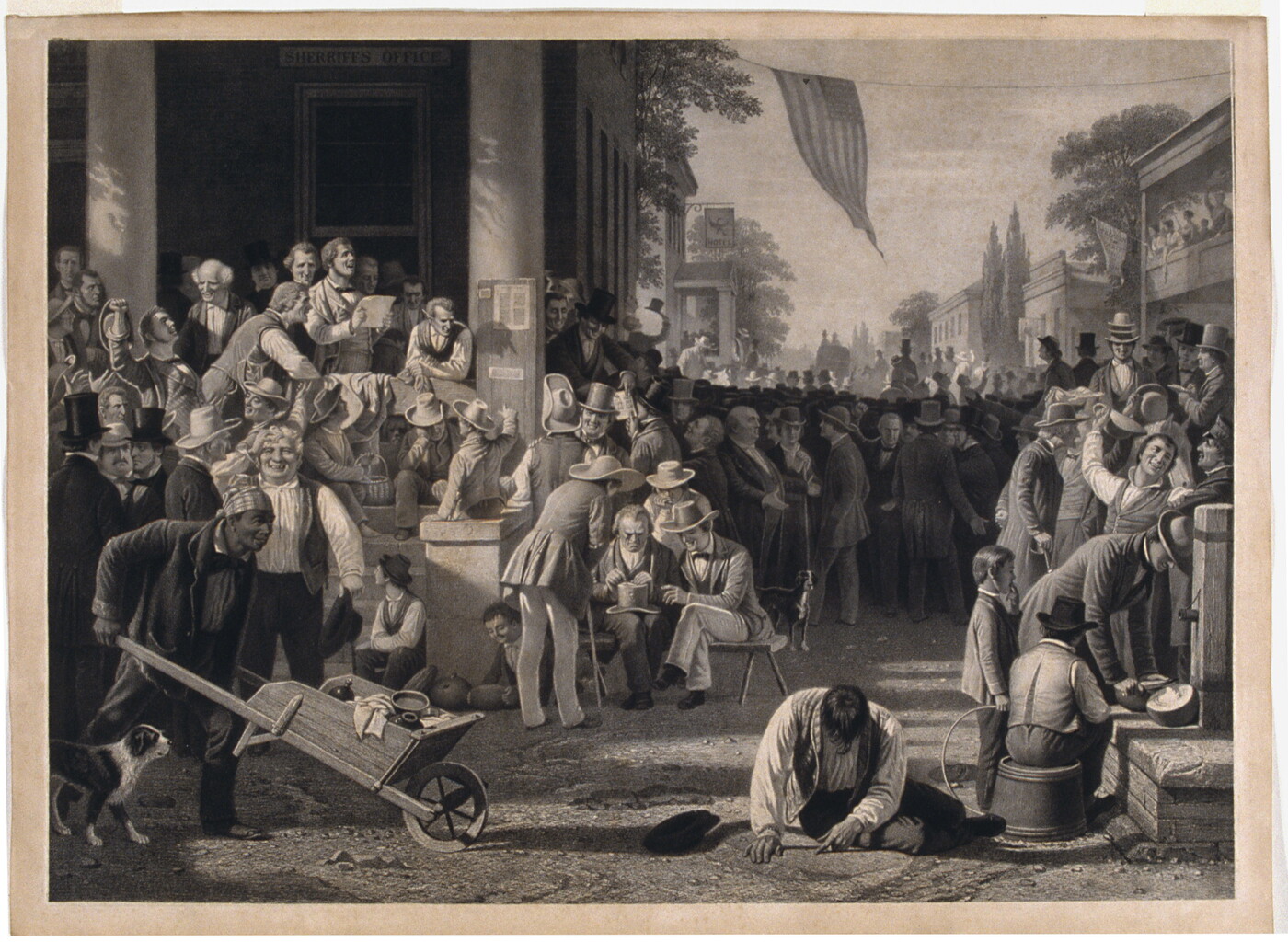 A black-and-white print of a large gathering of mostly White men crowding the street and front steps of the sheriff&#039;s office.